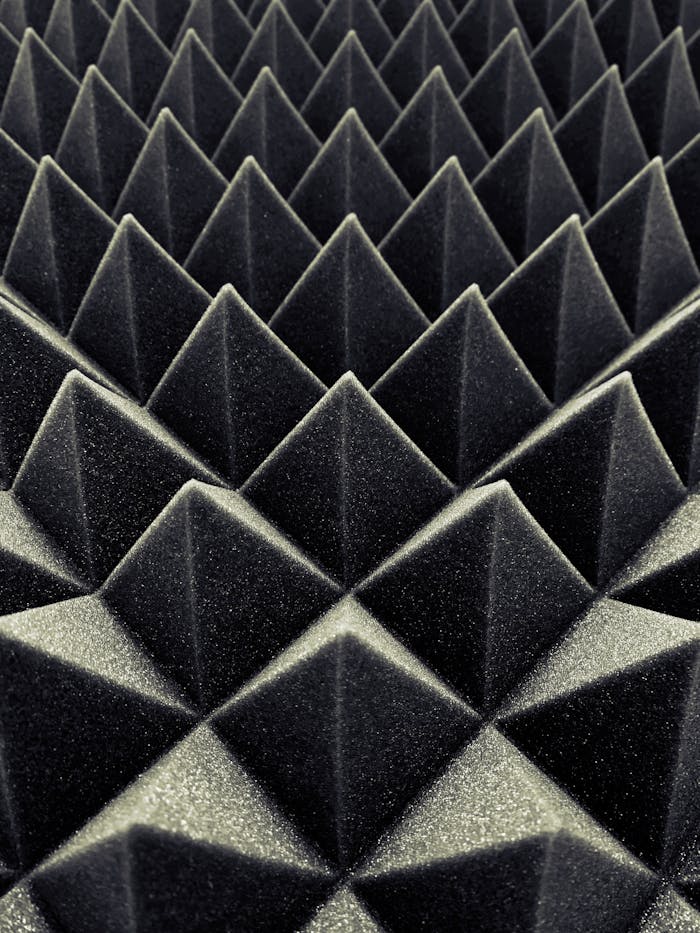 stats-img Textured black acoustic foam panels create a striking geometric pattern.